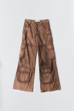 Deadwood's workwear-inspired cargo suede pants with wide flowing silhouette feature side pockets and multiple cargo pockets on the legs with a hidden push button closing. Made from upcycled deadstock goat suede Relaxed wide fit Zip fly Lining fabric from 100% recycled plastic bottles Luxury Brown Denim Bottoms, V Neck Cargo Pants, Luxury Leather Bottoms With Pockets, Stationery Brands, Janessa Leone, Suede Pants, Denim Outerwear, Maria Black, Simon Miller