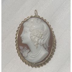 This Stunning Vintage Carved Shell Large Cameo Brooch And Pendant Is A True Testament To Timeless Beauty. The Oval Piece Showcases A Rare Left-Facing Woman. The Cameo Is Framed In Intricate 14k Solid Yellow Gold. The Cameo Is Stamped 14k On Back Bottom Lip Of Gold Frame. This Cameo Is 1.25 Inches Wide And 1.5 Inches Long. It Weighs 8.9 Grams. Bottom Lip, Cameo Jewelry, Carved Shell, Cameo Brooch, Solid Yellow, Cream White, Gold Frame, Timeless Beauty, Vintage Jewelry