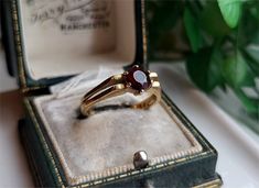 a ring in a box on top of a table