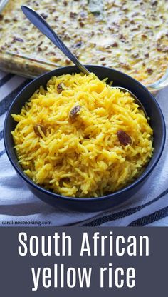 a bowl filled with yellow rice next to a casserole dish on a table