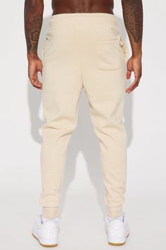 Model Height: 6'1 - Waist: 32 - Wearing Large Big & Tall: Height 6'3 - Waist: 42 - Wearing XXXL Available In Black, Grey, White, Navy, Red And Tan Elastic Waist With Drawstring Side Hand Pockets Back Patch Pocket Ribbed Cuff At Bottom Of Leg 80% Cotton 20% Polyester Imported | Mens Tyson Jogger Pant in Tan size Small by Fashion Nova Tall Height, Suede Shorts, Men's Toms, Mens Pants Fashion, Mens Fleece, Mens Activewear, Mens Sweatpants, Stylish Men, Model Height