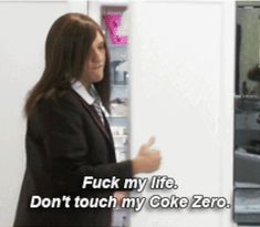 a woman standing in front of a refrigerator with the caption, i don't touch my coke zero