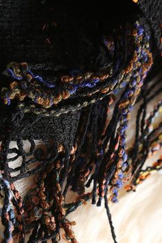 In Your Eyes Multi Color Knit Poncho This beauty is the perfect poncho to rock out this fall. Designed with a mix colors. Decorated with tassels on the trim. In Your Eyes Multi Color Knit Poncho is so comfy, soft, and perfect for the fall season. Details:Material:?Polyester Black Bohemian Shawl For Fall, Multicolor Fringe Scarf One Size, Multicolor Fringe Scarves One Size, Multicolor Fringed Scarves One Size, Bohemian Yarn Poncho For Fall, Bohemian Black Poncho For Fall, Multicolor Yarn Shawl For Fall, Winter Multicolor Poncho With Tassels, Multicolor Tassel Poncho For Winter