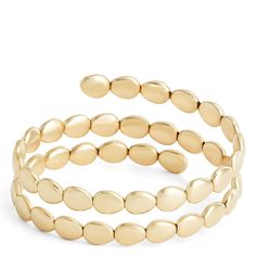 Our Toscano Collection celebrates gold’s lasting impact on style and creativity. We work with Italian artisans to bring you unique pieces that are as versatile as they are beautiful. This wrap bracelet is made with 14k yellow gold formed into beautiful beads that wrap around the wrist for an intriguing stacked look. Every piece from the collection pays tribute to generations of Italian gold jewelry making tradition combined with contemporary styling. Elegant Gold Bead Bangle Bracelets, Adjustable Yellow Gold Bangle With Polished Finish, Elegant Gold Beaded Bangle Bracelet, Modern Flexible Bangle Jewelry, Yellow Gold Bangle Beaded Bracelets, Fine Jewelry, Adjustable Modern Yellow Gold Jewelry, Yellow Gold Bangle Beaded Bracelets In Fine Jewelry, Modern Adjustable Yellow Gold Jewelry, Adjustable Flexible Yellow Gold Bangle