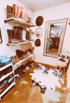 a room filled with lots of shoes and hats on top of shelves next to a mirror