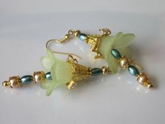 Lucite Flower Earrings Beaded Flower Dangle Light Golden | Etsy Delicate Green Flower Earrings, Gold Flower-shaped Czech Glass Earrings, Gold Flower-shaped Earrings With Czech Glass, Gold Flower Earrings With Czech Glass, Elegant Czech Glass Flower Earrings, Green Czech Glass Flower Earrings, Lucite Flower Earrings, Green Lily, Fantasy Earrings