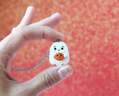 Funny Handmade Ghost Necklace made by me of Polymer Clay.No matter how old are you, it can be funny gift for everyone (:Approximate dimensionsNecklace:height: 3 cm. (  1.2"  )width: 2 cm.  (  0.8"  )chain length : 50cm. ( 20" )Earrings:height: 2.5 cm. (  1"  )width: 2 cm.  (  0.8"  )Keychain:height: 3 cm. (  1.2"  )width: 2 cm.  (  0.8"  )Brooch:height: 3 cm. (  1.2"  )width: 2 cm.  (  0.8"  )-Jewelry packed in little brown crafts box (:-All my jewelry are completely handmade so it can be slight Handmade White Kawaii Necklace, Whimsical Halloween Jewelry Gift, Fun White Necklaces For Gifts, Novelty White Handmade Necklace, Handmade White Novelty Necklace, Halloween Novelty Necklaces As Gift, Orange Novelty Jewelry For Gifts, Orange Novelty Jewelry For Gift, Novelty Orange Jewelry For Gift