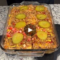 a casserole dish with sliced vegetables in it