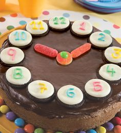 a chocolate cake decorated with colorful candies and numbers