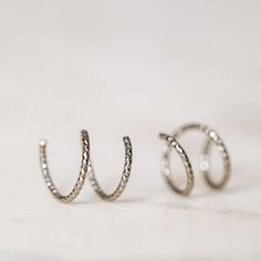 Tiny Double Hoop Earrings, Minimal Spiral Earrings, Tiny Twist Earrings, Double Hoop Earrings, Double Piercing, Diamond Cut Hoop EarringsTwist these little coils in and instantly get the appearance of two lobe piercings.(You only need ONE piercing to make these work-- they give the look of two!)(It can also be worn with two holes in case you have them)All you do is thread one side through your first hoop until the other side sits comfortably on your earlobe giving the illusion of a second hole. Two Lobe Piercings, Earrings Double Piercing, Twist Earrings, Lobe Piercings, Double Piercing, Earrings Minimal, Earrings Double, Double Hoop Earrings, International Jewelry