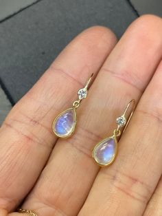 "Natural Blue Moonstone and Diamond 14K Yellow Gold Drop Earrings The diamonds are .06 carats each, VS with  F color. The moonstones are each approximately 2 carats, with a double sided cabochon cut. 1.5\" long from top to bottom  Made in solid 14K yellow gold. Custom orders welcome!" Elegant Pear-shaped Moonstone Jewelry, Elegant Moonstone Earrings With Gemstone Accents, Teardrop Moonstone Earrings With Gemstone Accents, Wizard Jewelry, 14k Yellow Gold Drop Earrings, Pink Gemstone Necklace, Yellow Gold Drop Earrings, Cabochon Earrings, Gemstone Drop Earrings