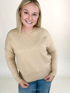 This cozy sweater, in a soft oatmeal, offers a timeless look that’s easy to dress up or down. Wear it alone for a simple, chic outfit, or layer it under a vest or flannel for added warmth and style. Available in small, medium, large, & extra large Color: Oatmeal Emily is 5'6" and has a 34c bust. She is wearing a medium. Runs true to size Ribbed round neckline Ribbed cuff and hem Paired here with our Megan Mid Rise Raw Hem Wide Leg Denim Solid Everyday Winter Sweater, Winter Solid Color Everyday Sweater, Winter Everyday Sweater, Cozy Cashmere Tops For Layering, Cozy Solid Sweater For Layering, Cozy Solid Color Layering Sweater, Everyday Spring Sweater With Ribbed Neckline, Spring Everyday Sweater With Ribbed Neckline, Spring Sweater With Ribbed Neckline