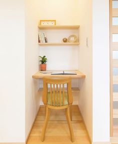 a wooden chair sitting in front of a desk