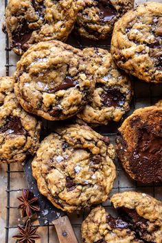 chocolate chip cookies on a cooling rack with anise and star anise next to them