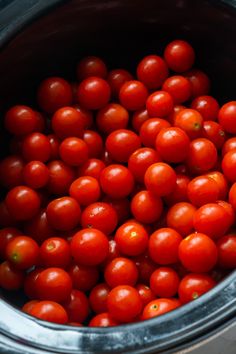 the tomatoes are in the pot ready to be cooked