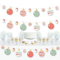 a cake and cupcakes on a table with christmas decorations