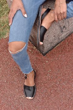 Our classic style avarca sandal in black leather. One of the basics we all should have in our closet. They are made with soft napa leather.  #avarca #flats #leather #black #comfy #shoes #slipon #wedges #spanishsandal #streetstyle Beach Slip-on Slingback Sandals With Leather Sole, Chic Slip-on Flip Flops, Casual Mules With Textured Sole, Casual Everyday Mules With Textured Sole, Summer Slingback Sandals With Rubber Sole And Open Heel, Summer Open Heel Slingback Sandals With Rubber Sole, Summer Vacation Slingback Sandals With Rubber Sole, Casual Everyday Mules With Flat Heel, Leather Sole Sandals For Everyday