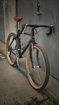 a bike parked on the side of a building