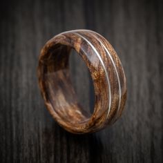 a wooden ring with white stripes on it