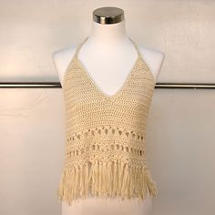 This Crochet Halter Features Back And Neck Ties And Fringed Edges. Always A Classic Boho Summer Beach Vibe, But Also A Must-Have If You're Trying To Curate That "Coachella 2010's" Aesthetic. Size Small/Medium. The Color Is Whiter Than It Appears In Photos. Festival Beige Tops With Crochet Trim, Beige Crochet Top With Crochet Trim For Beach Season, Beige Crochet Lace Top For Beach Season, Beige Crochet Trim Top For Beach Season, Beige Crochet Lace Tops For Festival, Beige Crop Top With Crochet Trim For Vacation, Summer Beige Crochet Tops, 2010's Aesthetic, Beige Crochet Summer Tops