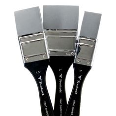 three paint brushes with black handles and silver tips