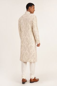 Silver cream sherwani with front buttons and floral embroidery. Paired with churidar.
Component: 2
Pattern: Embroidered
Type Of Work: Floral
Neckline: Mandarin
Sleeve Type: Full
Fabric: Silk
Color: Silver,Cream
Other Details: 
Front buttons
Occasion: Wedding - Aza Fashions Cream Sherwani, Kurta For Men, Silver Silk, Luxury Sale, Sequins Embroidery, Fabric Silk, Churidar, Embroidered Silk, Festival Wear