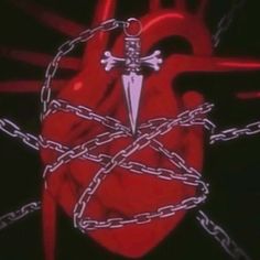 a heart with chains and a cross on it