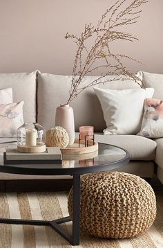 a living room filled with furniture and pillows