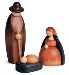 two wooden figurines are standing next to each other