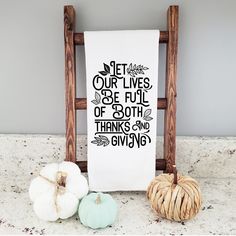 a kitchen towel with the words let our lives be full of both thanks and giving