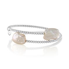 This chic bangle pearl bracelet features two 9mm white baroque freshwater pearls on each side. The pearls are mounted on the finest 18K gold bangle bracelet, in your choice of white gold or yellow gold. The bangle comes in a standard one size fits all. This item comes packaged in a beautiful jewelry gift box, perfect for gifting. Luxury Statement Pearl Bangle Bracelet, Pearl White Bangle Bracelet With Pearl Charm, Pearl White Bangle With Pearl Charm, Pearl White Bangle Pearl Bracelet, White Pearl Bangle As A Gift, Pearl White Pearl Bangle Bracelet, Elegant White Pearl Bangle, Adjustable Stackable Pearl Bracelet, Luxury White Baroque Pearl Bracelets