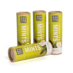 three green tea mints are sitting next to each other on a white background,