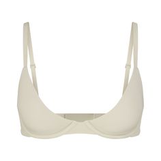 This lightly lined, buttery-soft scoop bra is engineered for an ultra-comfortable, barely-there fit with innovative cup technology to fit in between sizes. Features flexible, supportive underwire, adjustable straps, and hook and eye back closure. Fits true to your SKIMS bra size. Everyday Fitted Bra With Padded Cups, Everyday Seamless Underwire Bra, Everyday Seamless Underwire Nursing Bra, Everyday Full Coverage Padded Nursing Bra, Everyday Underwire Bra With Built-in Support, Everyday Underwire Bra With Built-in Bra, Everyday Full Coverage Padded Bra, Everyday Full Coverage Bra With Padded Cups, Classic Underwire Bra With Soft Touch