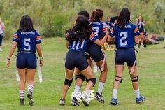 a group of women playing soccer on a field