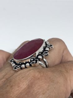 Unusual deep toned raw Ruby low content silver setting handmade size 8 Can be resized. My jeweler charges a $10- $20 fee All rings are shipped in a nice gift box. Check out our over a THOUSAND great reviews Engraving is $4 per letter and is not always perfect depending on the piece. It can take a few days if the jeweler is busy. This is payable to Paypal Judithsltd@gmail.com Handmade Adjustable Ruby Ring In Sterling Silver, Handmade Spiritual Ruby Ring In Sterling Silver, Silver Oval Ruby Ring Spiritual Style, Handmade Spiritual Sterling Silver Ruby Ring, Handmade Bohemian Oval Ruby Ring, Bohemian Handmade Oval Ruby Ring, Spiritual Ruby Rings For Gifting, Artisan Oval Ring As Gift, Handmade Silver Round Ruby Ring