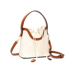 Mini Bags Are Maximum Trends. Sophistication And Refinement In A Classic Silhouette And Color. Perfect Timeless Bucket Shape For A Go Everywhere Look. Canvas Texture, Tan Faux Leather Trim Drawstring Closure With Matching Tags 44” L Detachable And Adjustable Long Strap For Cross Body Style 7” X 6.6” X 4”, 3” Handle Also In Pink, Purple, Green And Black Beige Bucket Bag With Large Capacity For Evening, Trendy Beige Bucket Bag With Single Shoulder Strap, Versatile Beige Crossbody Bucket Bag, Beige Evening Bag With Adjustable Strap For Travel, Versatile Beige Shoulder Bucket Bag, Cream Evening Bag With Adjustable Strap, Feminine Cream Crossbody Shoulder Bag, Beige Bucket Bag With Single Shoulder Strap, Beige Crossbody Evening Bag With Detachable Handle