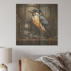 a bird sitting on top of a bed next to a wall mounted art piece in a bedroom