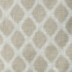 a beige and white fabric with small squares on it