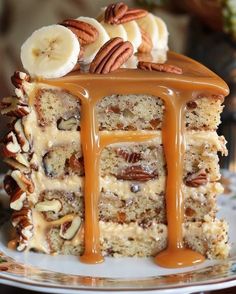 a piece of cake with nuts and caramel drizzled on the top