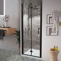 Modern and refined, the Frameless Povit Door collection offers your bathroom a very glamorous look. It uses tempered glass and is SGCC certified to ensure safe use and installation. The sturdy and corrosion-resistant stainless steel handle intensifies its timeless stylish look. Our Shower Doors offer an adjustable distance of 20 mm on each sides to accommodate different wall spacing. The versatile installation of either the right-or-left hand door opens to meet your operating habits. The glass is covered with an Easy Clean coating treatment, which can repel water, soap scum, and dirt. This helps to reduce the cleaning time by up to 90%, turning the current alcove into an elegant shower destination. WELLFOR EX Small Bifold Shower Door Black 32-in to 33-in W x 72-in H Frameless Bifold Shower Shower Door Black, Bifold Shower Door, Door Black, Door Detail, Pivot Doors, One Piece Toilets, Dream House Interior, Shower Door, The Shower