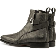 This ankle boot features an equestrian-inspired design and a strap-and-buckle fastener that wraps around its shaft.The Jodhpur Boot was initially worn by the best horsemen from the Indian Jodhpur state. The Jodhpur name has been naturally chosen for this model, which over time has become a great men’s shoemaking classic. Materials: grey lux suede + grey exotic python Lining: navy calf leather Sole: cognac goodyear leather sole + buttons rubber injections The Fine Print: Shoe production timeline/ Jodhpur Boots, Great Men, Pet Gear, Fine Print, Jodhpur, Men Care, Mobile Photography, Cloth Bags, Python