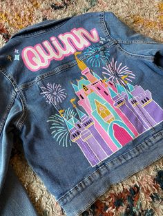 A handpainted denim jacket with your custom design. After your purchase we can discuss sizing and design details, and I will create a digital mock up of the design for you to approve before I begin painting. Feel free to reach out if you have any other questions or concerns regarding this listing. Rush order options available, message for details! Handpainted Jean Jacket, Custom Painted Denim Jacket, Painted Disney Jacket, Custom Painted Jean Jacket, Disney Painted Jean Jacket, Diy Jacket Paint, Trendy Cotton Denim Jacket With Custom Artwork, Painted Blue Jean Jacket, Painted Jacket Ideas