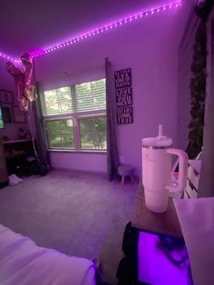 a room with purple lights and a coffee cup