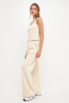 Step up your lounge game with our chic wide knit pants. These pants are sure to become your new favorite, whether you're relaxing at home or running errands. The wide leg and knit fabric give them a stylish look, while the beige cream hue makes them easy to pair with any top. Plus, they're so comfortable you'll never want to take them off! Wide pants Knit Elastic at waist Shell: 55% Cotton 43% Polyester 2% Spandex JJ941P XS Total length: 42.75", Waist: 26", Inseam: 30.5" Wide Pants, Knit Pants, Matching Top, Ribbed Fabric, Dressed Down, Running Errands, Step Up, Knit Fabric, Wide Leg