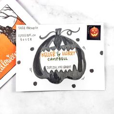 two halloween greeting cards on top of each other