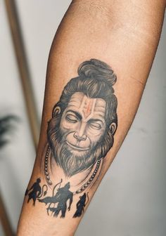 a man with a tattoo on his arm