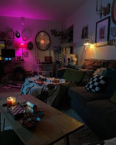 a living room filled with furniture and purple lighting