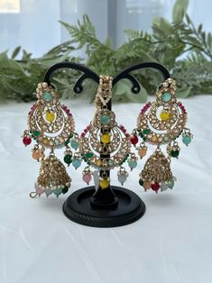 Kundan jewelry set includes a pair of earrings and a tikka. Colour: multicolour Fusion Multicolor Jewelry Sets For Diwali, Fusion Style Multicolor Jewelry Sets For Diwali, Multicolor Tilla Jewelry For Gifts, Fusion Style Multicolor Jewelry Sets, Bohemian Multicolor Jewelry Sets With Tilla, Multicolor Chandbali Jhumkas As Gift, Multicolor Chandbali Jhumkas For Gift, Multicolor Hand Set Temple Jewelry Sets, Multicolor Fusion Style Festive Jhumkas