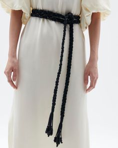 Woven leather is braided seamlessly into cotton cords that wrap effortlessly around your waist and finishes with a wrapped beaded tassel. Wraparound closure Length: 104” Width: ¾” Cotton + Leather Braided Fabric, Night Tops, Black Ombre, Black Chevron, Braided Belt, Maximalism, Fabric Belt, Tops Fall, Fall Shopping