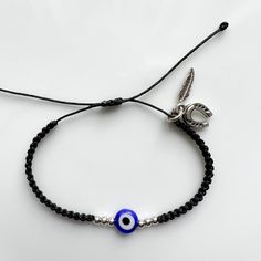 ♥Perfect gift for you and your favorite person♥. ♥Discover timeless beauty and symbolic protection with our handwoven Black bracelets. Each piece is imbued with artisanal quality and protective charm, such as the Blue Evil Eye for protection and other charms to ward off negative energies. These bracelets are more than jewelry; they are amulets of durability and significance, perfect for gifting to someone special or adding an extraordinary touch to your own style. Acquire a symbol of protection Symbolic Evil Eye Bracelets As Gifts, Symbolic Evil Eye Bracelet For Friendship, Adjustable Evil Eye Charm Bracelet Gift, Evil Eye Bracelet With Sliding Knot As Gift, Handmade Silver Evil Eye Bracelet For Friendship, Black Evil Eye Bracelet With Sliding Knot As Gift, Evil Eye Beaded Bracelets As Gift, Adjustable Charm Bracelet With Evil Eye, Adjustable Evil Eye Charm Bracelet